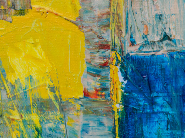 abstract painting in smears of blue and yellow 