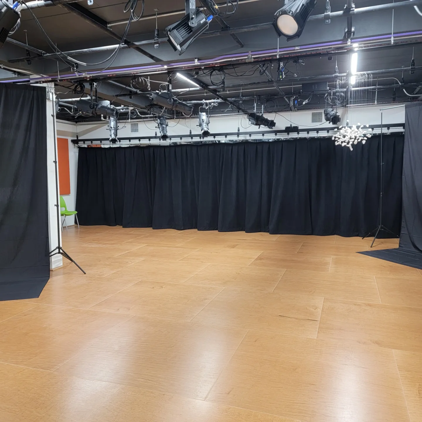 empty rehearsal stage with black curtain along the back