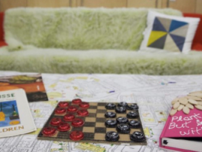 couch with checkerboard and journal