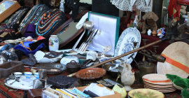plates, postcards, jewelry, and assorted flea market items